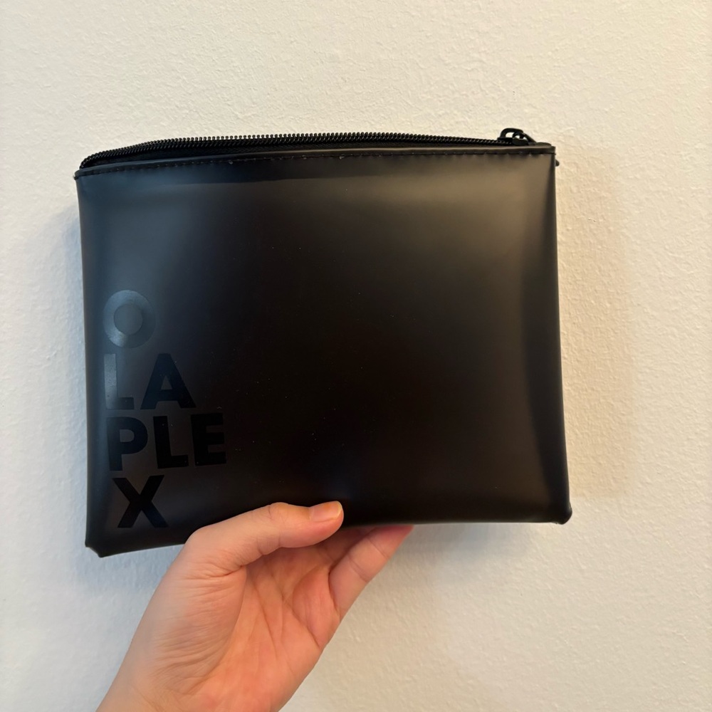 Olaplex makeup black bag, kind of transparent 
Brand new, never used